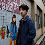 **

A poignant scene from a Korean drama, possibly set in a modern urban environment. Focus on emotional depth and relatable themes such as youth unemployment or mental health challenges faced by young adults. The style should be visually captivating, reflecting the high production quality of K-dramas, with a slightly melancholic tone. Consider adding elements of social commentary subtly woven into the background, like posters or graffiti reflecting social issues.

**
